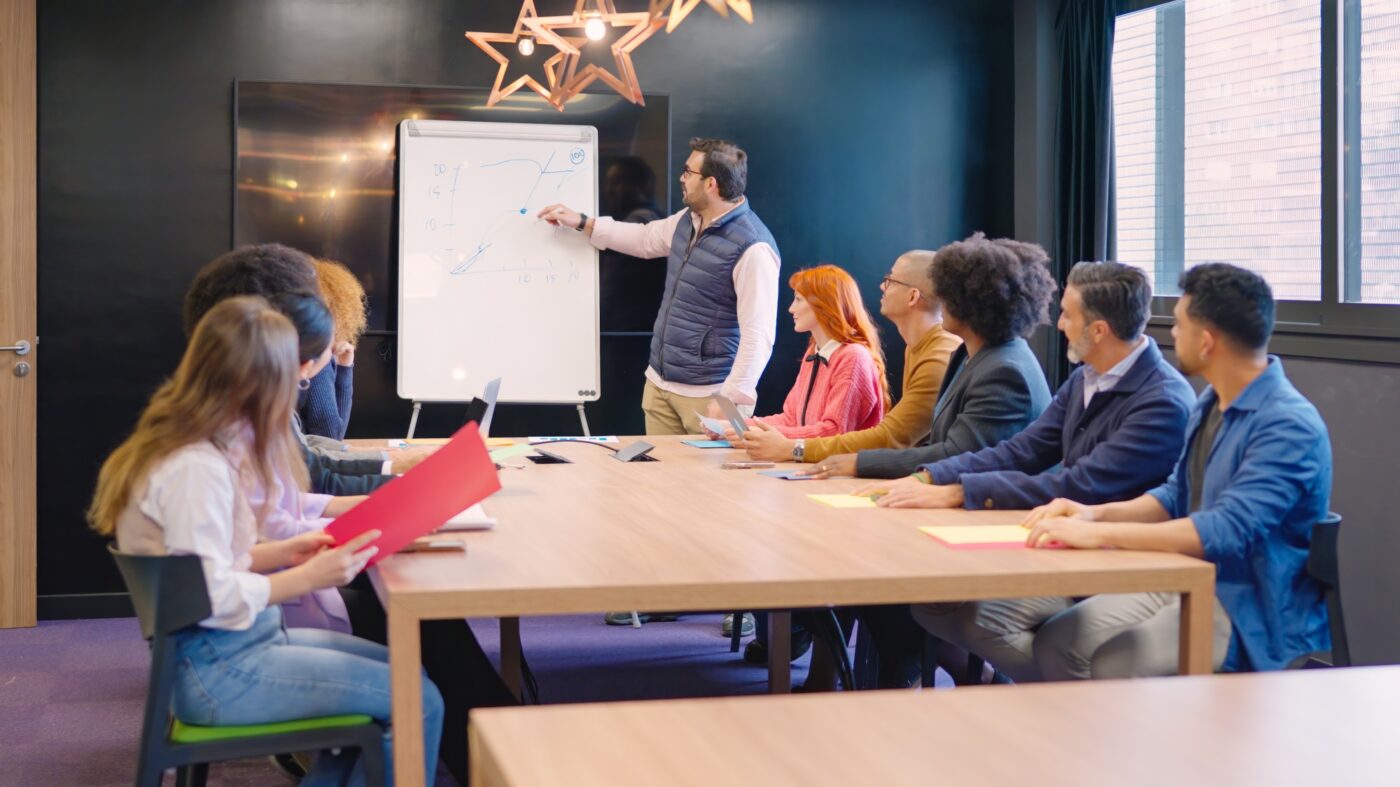 Man presenting a new project in a coworking during meeting
